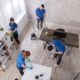 Office cleaning service by four workers