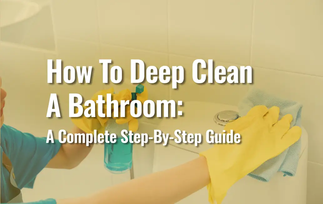 Person Wearing Yellow Rubber Gloves Cleaning A Toilet Tank With A Blue Microfiber Cloth, With A Spray Bottle In Hand — Featured Image For 'How To Deep Clean A Bathroom: A Complete Step-By-Step Guide